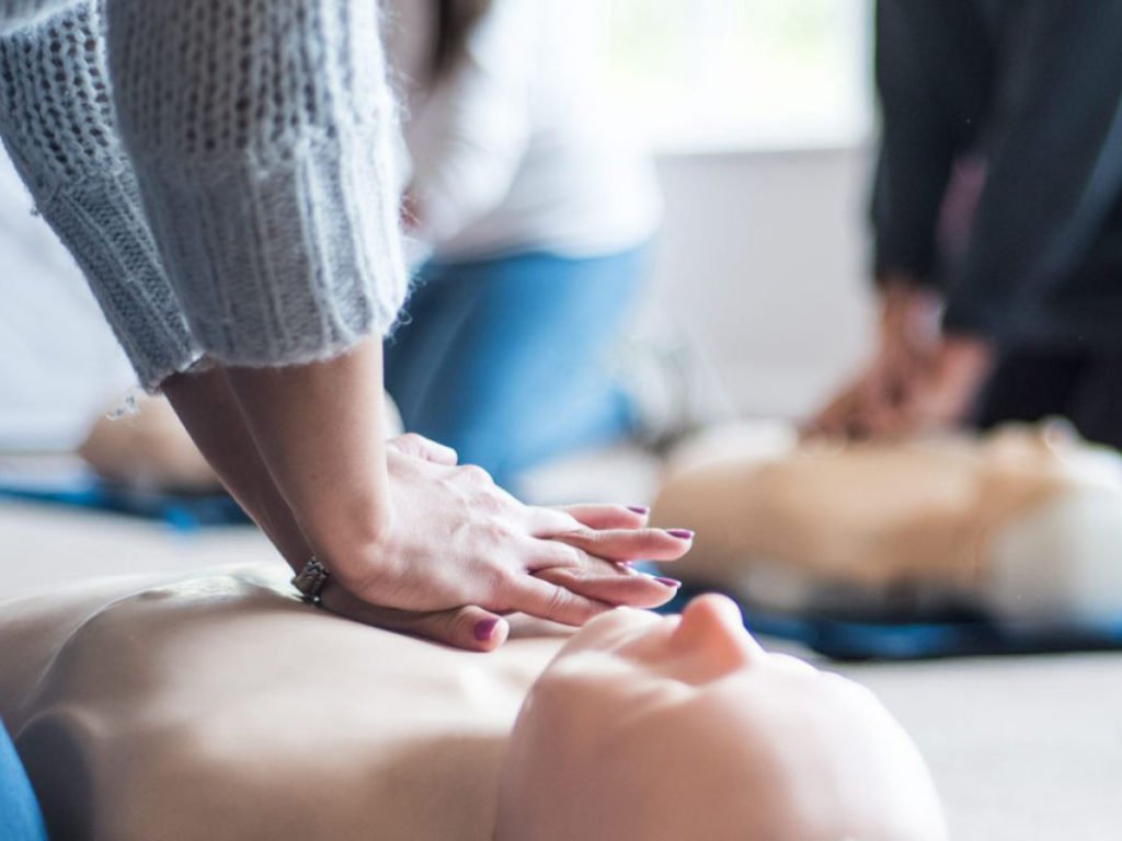 woman performing cpr - cpr aed course singapore | medlink healthcare group