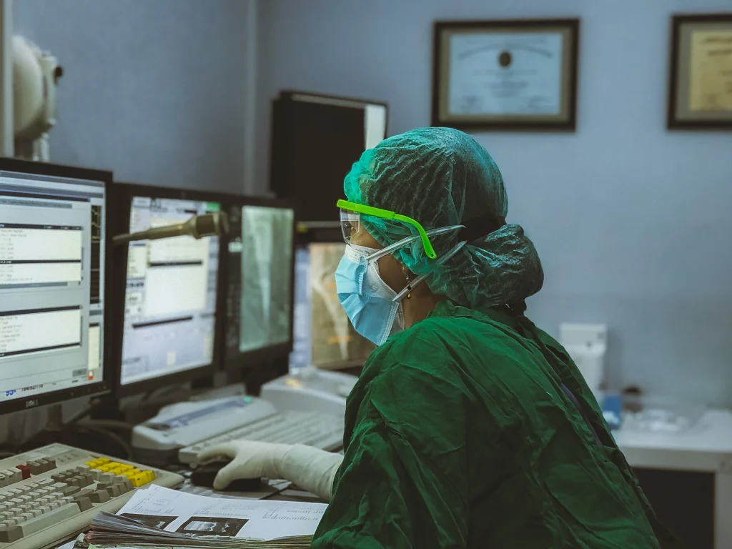 Clinician monitoring patient vitals around the clock