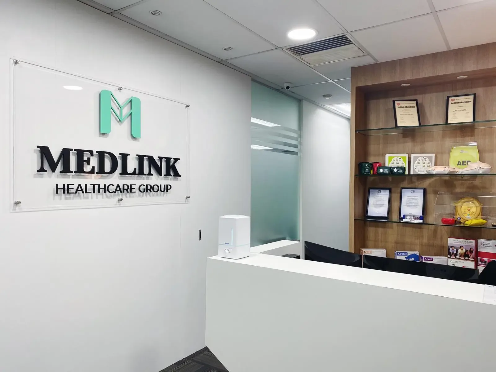 Medlink Healthcare Group reception, with AEDs and first aid supplies on display